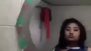 Beautiful desi girl lifting top to reveal sexy boobs