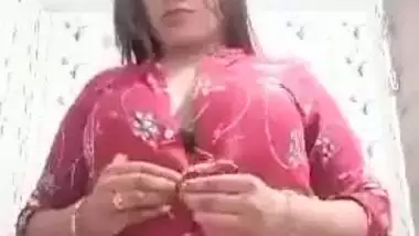 Sexy girl shows her boobs and ass to striptease her BF