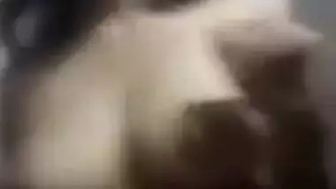 Sweet Desi gal sneaks in bathroom to show tits with big XXX nipples