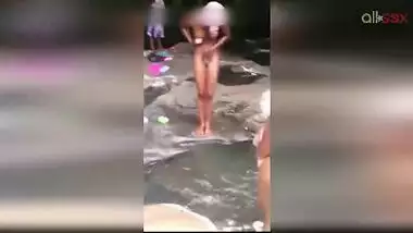 Lewd amateur Desi aunty flashing her nice big tits while bathing outdoor