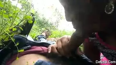 Guy simply lies on back but sex partner gives him a blowjob outdoors