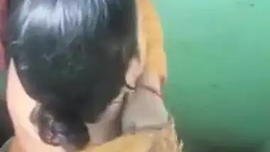 Female wears a yellow Indian sari after flashing her charms in voyeur porn video