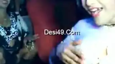 Excited Desi dancer covered in water during an XXX show in the club