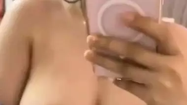 Hot ass sexy figure showing firm boobs by lowering bra